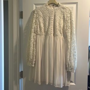 High neck, button down. White flowy dress